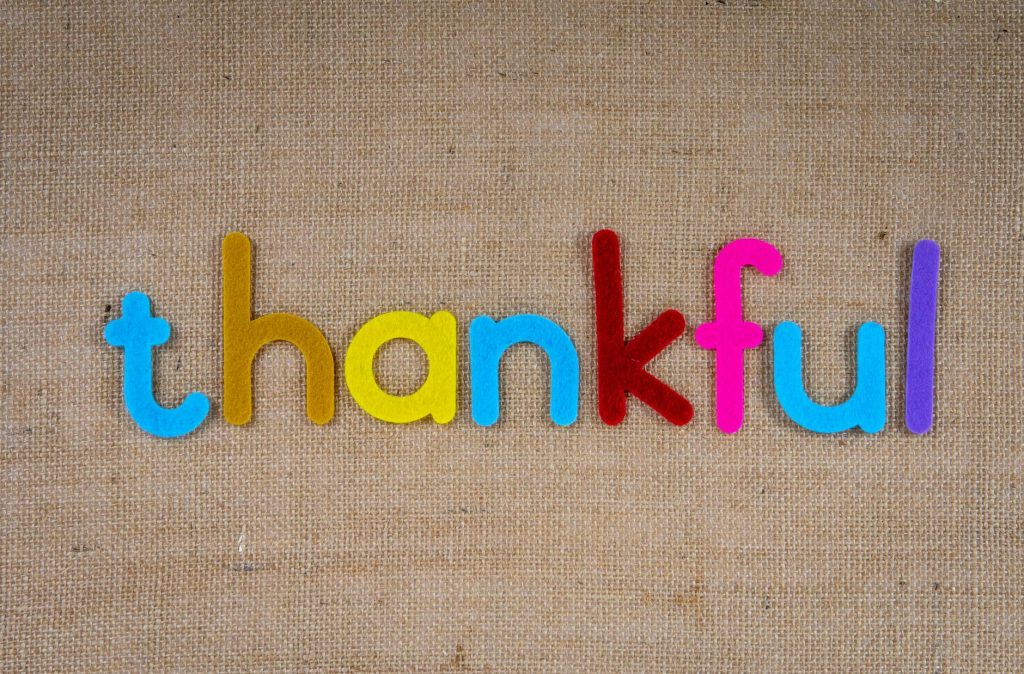 the word thankful on a woven surface